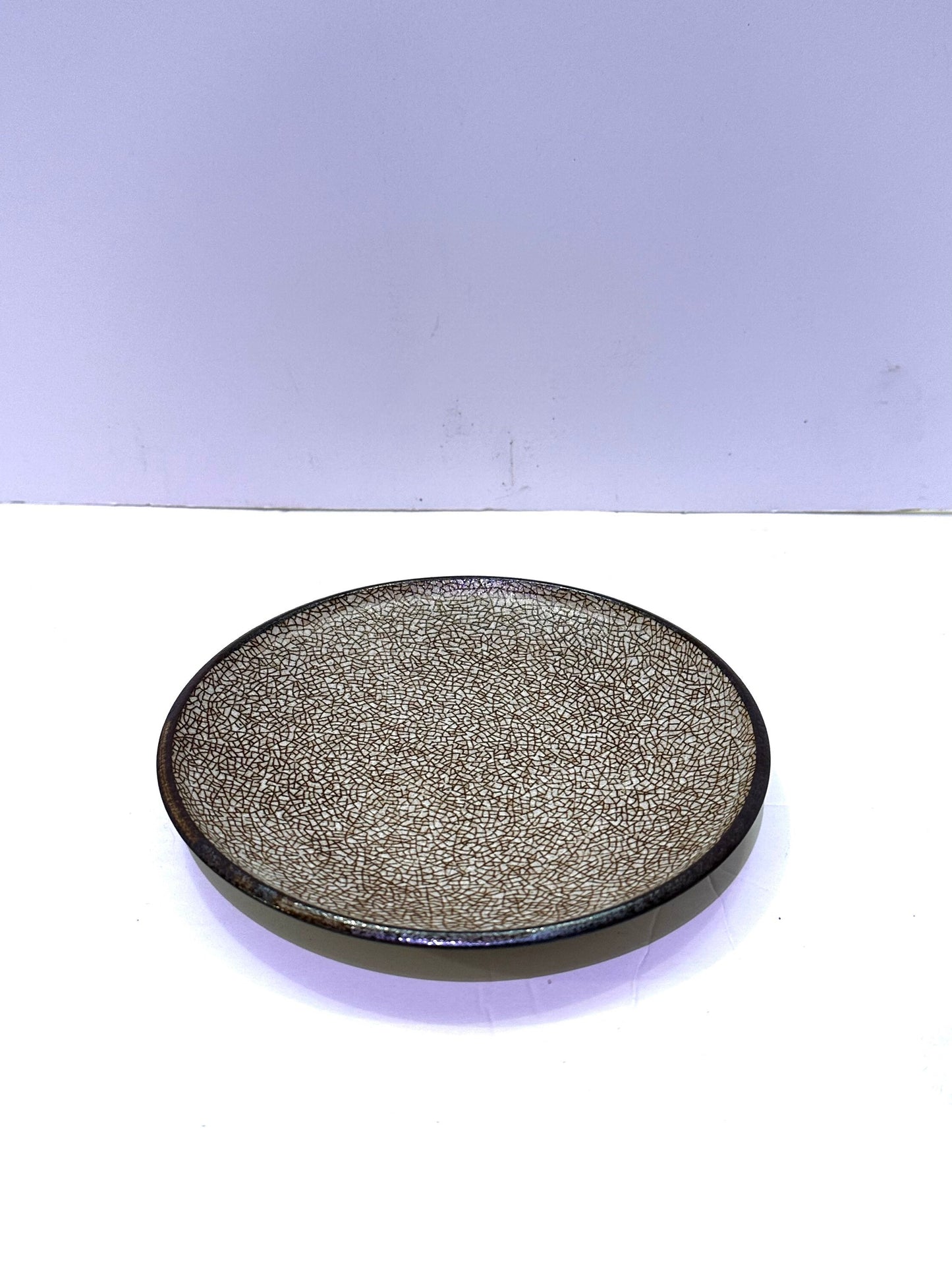Ocher, Japanese traditional ceramic. Beautiful earth ocher colored with dry brush stroke on the edge with darker earthy brownish color.