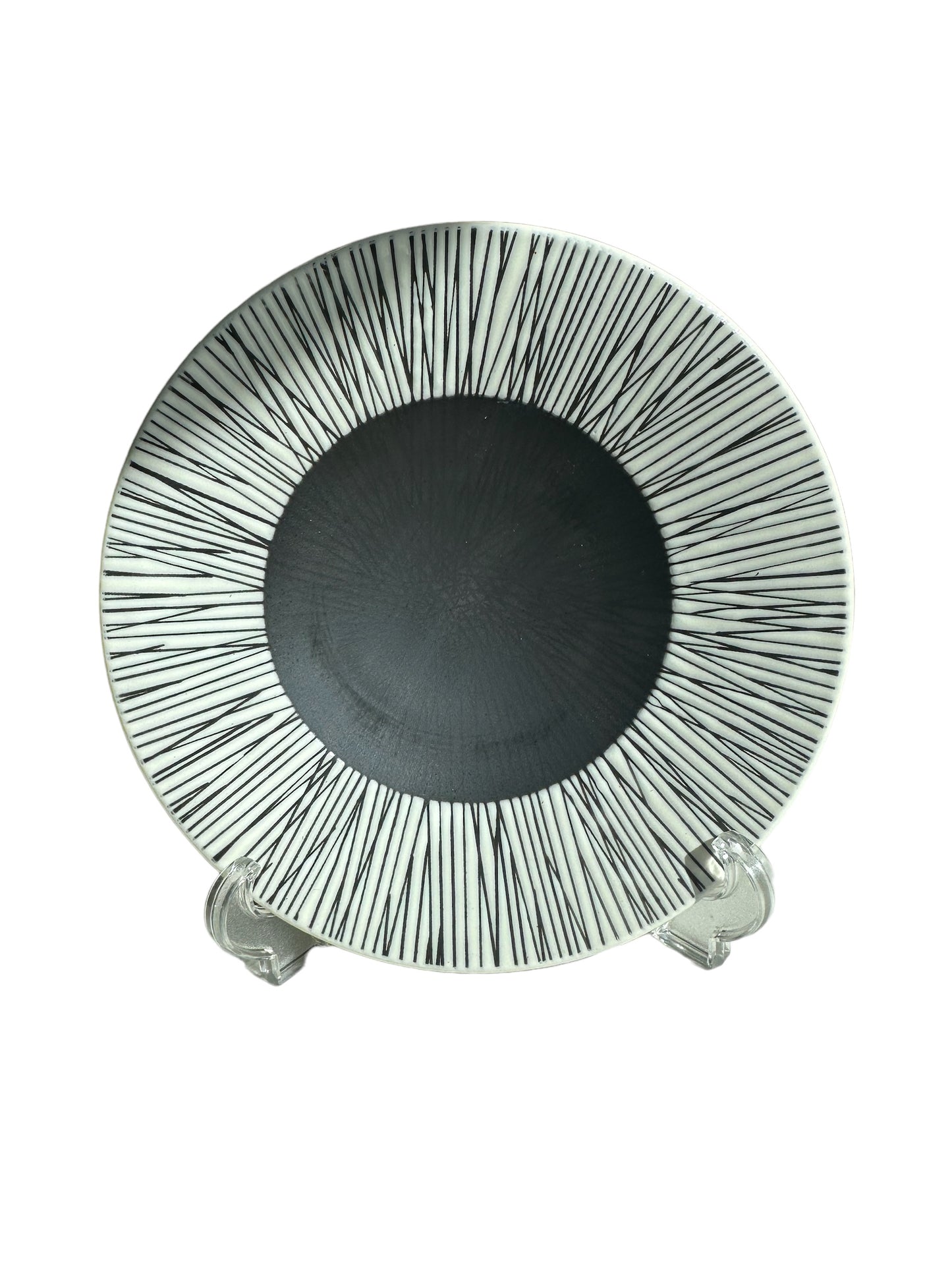 Radial pattern of black lines on 8" decorative plates